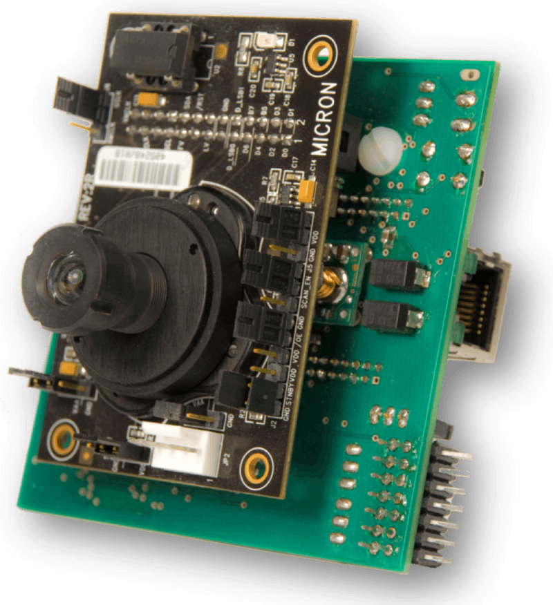Custom FPGA smart camera board from 2007: a CMOS sensor module mounted on a Virtex-4 carrier board with Ethernet